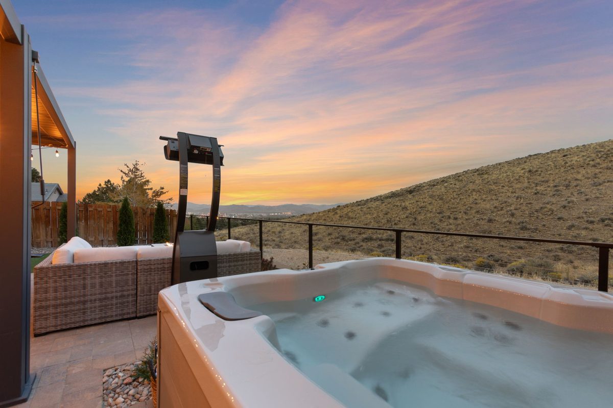 Hot tub facing the hills at sunset
